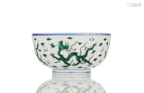 A GREEN DRAGON ON STYLIZED WAVES PORCELAIN BOWL