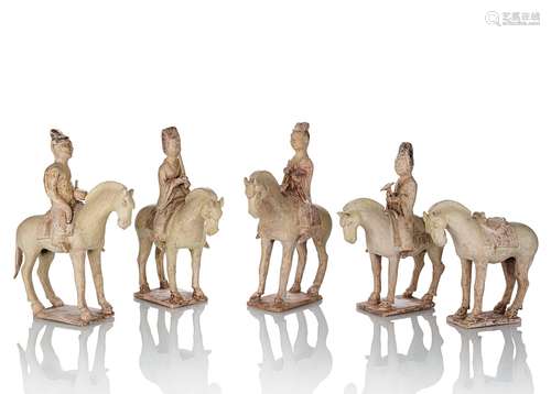 A GROUP OF FOUR STRAW-GLAZED EARTHENWARE HORSES AND RIDERS A...