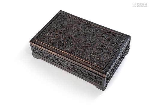 A CARVED DRAGON RELIEF LIDDED WOOD BOX; DECORATED INSIDE THE...