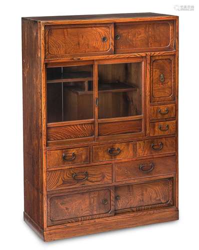 A WOOD TANSU CONTAINING A GLAZED DISPLAY SHELF