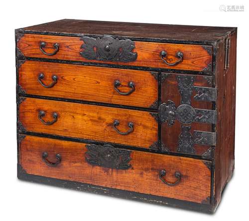 A KEYAKI WOOD TANSU CONTAINING SEVEN DRAWERS AND WITH DECORA...