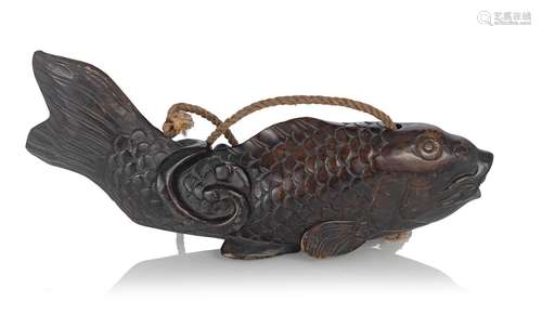 A CARVED-WOOD KETTLE HOLDER (JIZAI KAGI ) IN SHAPE OF A CARP