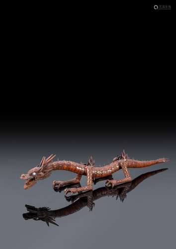 A WOOD ARTICULATED MODEL OF A DRAGON