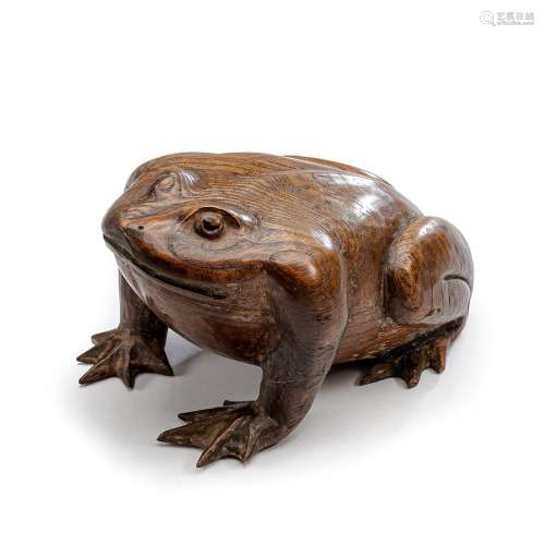 A CARVED WOOD OKIMONO OF A SEATED TOAD