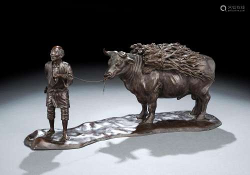 A CAST-BRONZE GROUP OF A PEASANT MAN WITH HIS OX