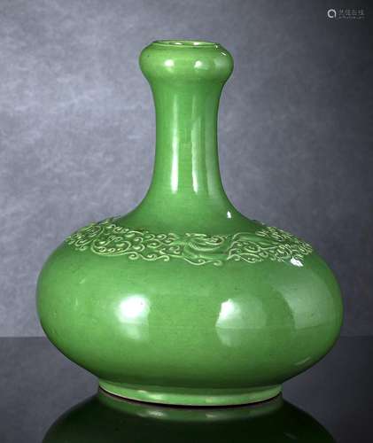 A GREEN-GLAZED MOLDED BOTTLE VASE