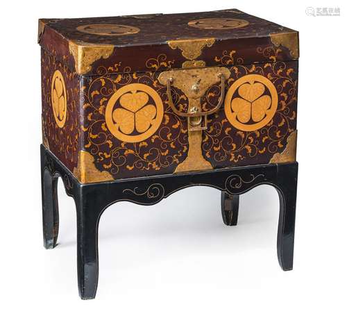 A LACQUER DECORATED CHEST ON A STAND WITH TOKUGAWA CLAN EMBL...