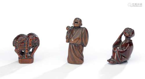 A GROUP OF FOUR WOOD NETSUKE