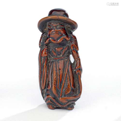 A BOXWOOD NETSUKE OF A MONGOL ARCHER