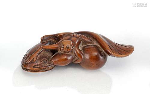 A BOXWOOD NETSUKE OF KADORI MYÔJIN