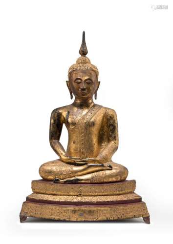 A GILT, RED AND BLACK LACQUERED BRONZE FIGURE OF BUDDHA SHAK...