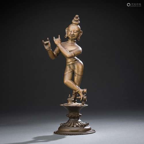 A BRONZE FIGURE OF KRISHNA