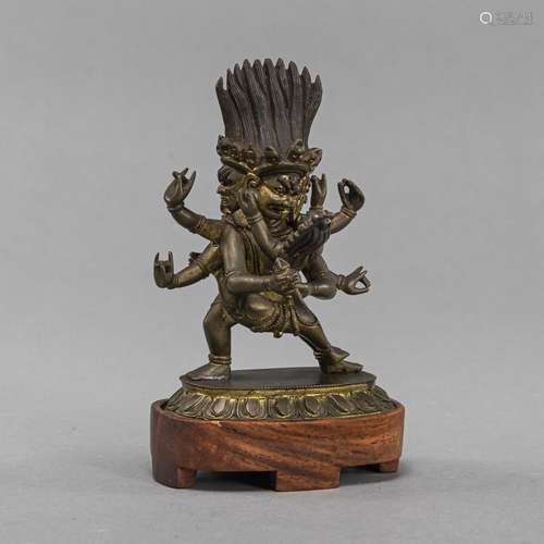 A SMALL BRONZE FIGURE OF MAHAKALA IN YAB-YUM WITH HIS CONSOR...