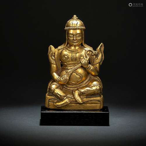 A GILT-BRONZE FIGURE OF DHRTARASTRA