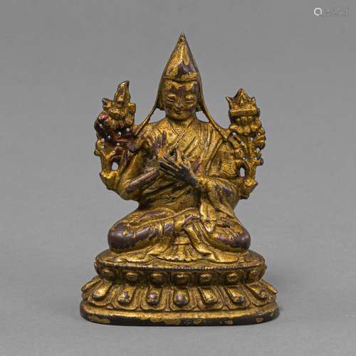 A GILT-BRONZE FIGURE OF TSONGKHAPA