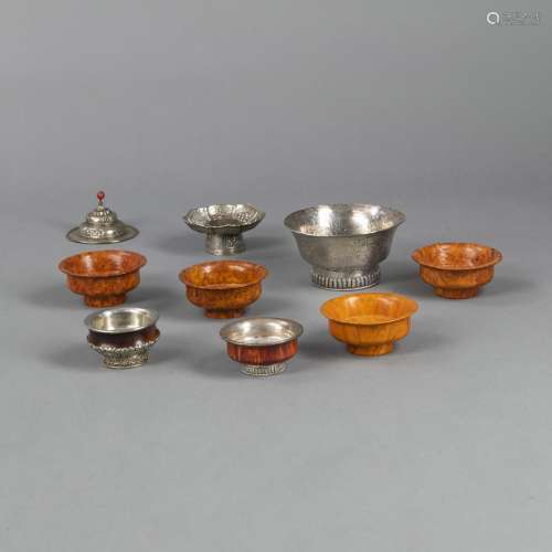 A SILVER BOWL, A CUP STAND, AND PARTIALLY SILVER-MOUNTED TEA...