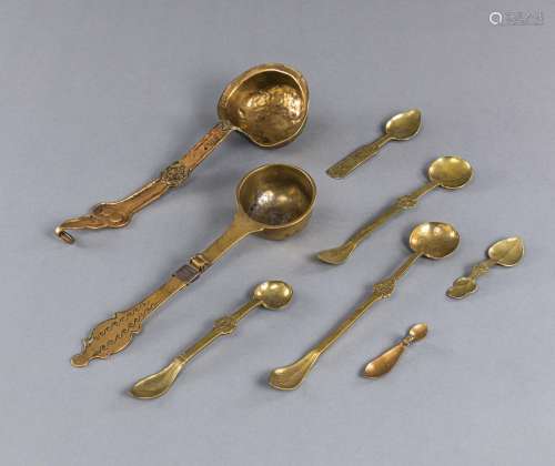 EIGHT YELLOW-METAL SPOONS AND LADLES