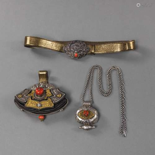 A FIRESTONE POCKET, AN AMULET CASE WITH A CHAIN AND A BELT B...