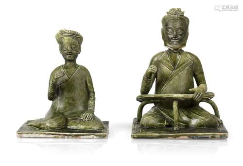 TWO UNUSUAL GREEN GLAZED POTTERY FIGURES OF A SITTING WOMAN ...