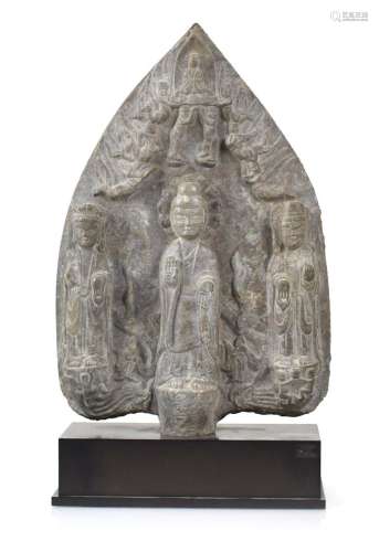 A CARVED LIME STONE MANDORLA DEPICTING BUDDHA AND TWO BODHIS...