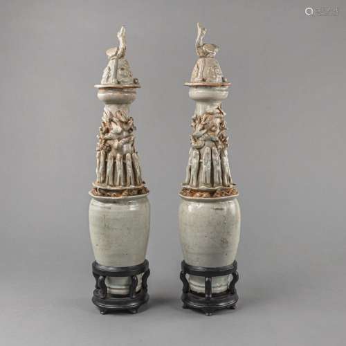 A PAIR OF QINGBAI GLAZED URN VASES WITH COVER AND WOODEN STA...