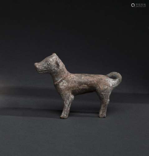 A PAINTED GREY EARTHENWARE MODEL OF A STANDING DOG