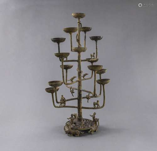 A BRONZE CANDELABRA WITH BIRDS AND MONKEYS