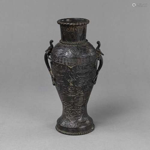 AN ARCHAISTIC STYLIZED CHILONG HANDLED BRONZE VASE