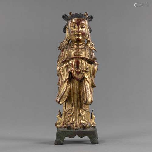 A GILT-BRONZE FIGURE OF A WORSHIPPER HOLDING A MANUSCRIPT