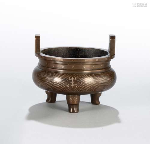 A SILVER-INLAID TRIPOD BRONZE CENSER