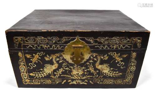 A LEATHER CHEST WITH INLAID PEACOCK DECORATION