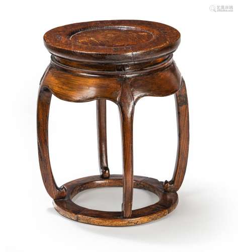 A DRUM-SHAPED WOOD STOOL