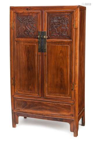 AN ELMWOOD CABINET WITH CARVED DECORATION OF ANTIQUES