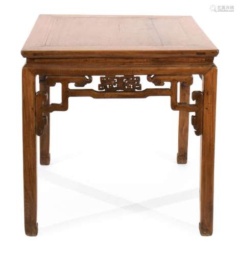 A SQUARE TABLE WITH VOLUTED APRON