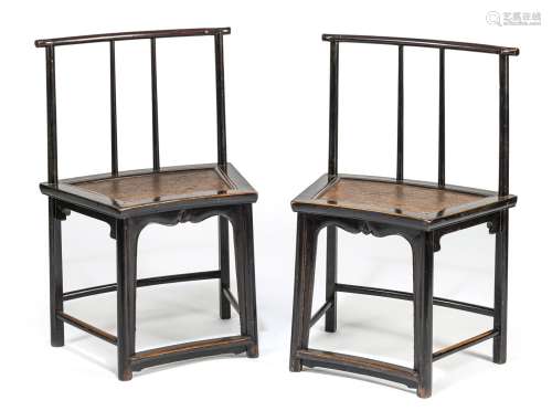 A PAIR OF BLACK-LACQURED CHAIRS
