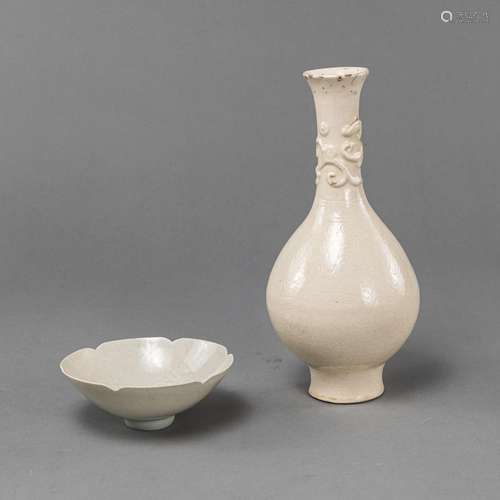 A CREME-GLAZED CHILONG RELIEF VASE AND A FOLIATE-RIM QINGBAI...