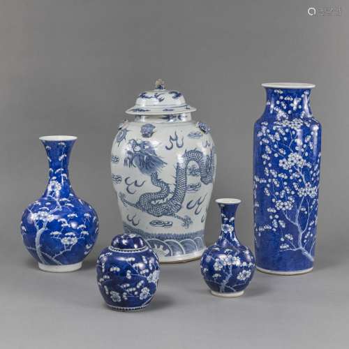 FOUR BLUE AND WHITE PRUNUS PORCELAIN VASES AND A DRAGON VASE...