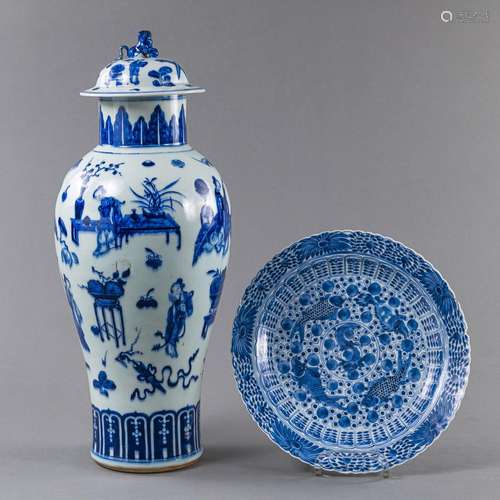 A BLUE AND WHITE FIGURAL VASE AND COVER AND A FISH DISH