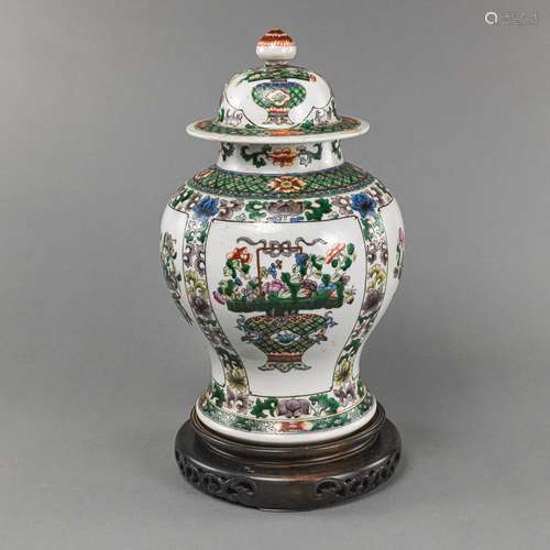 A FAMILLE VERTE FLORAL BALUSTER VASE AND COVER