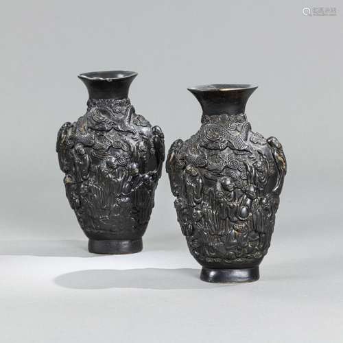 A PAIR OF FIGURAL FAUX-BRONZE PORCELAIN VASES