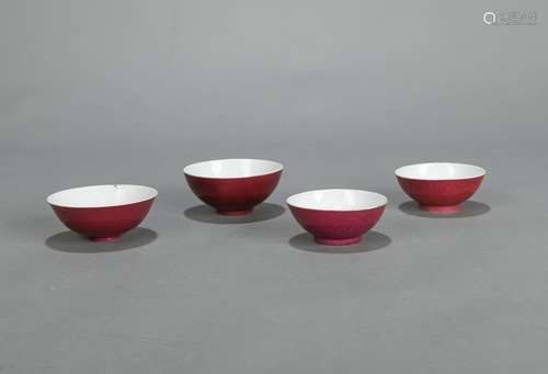 FOUR RED-GLAZED PORCELAIN BOWLS