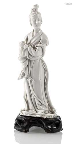 A DEHUA MODEL OF STANDING GUANYIN WITH VASE