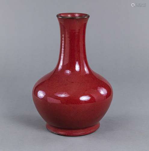 A RED-GLAZED BOTTLE VASE