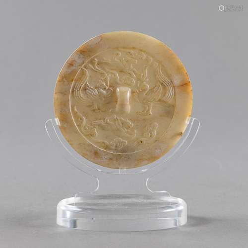 A CARVED YELLOW-WHITE JADE MIRROR WITH PHOENIXES AND ANIMALS