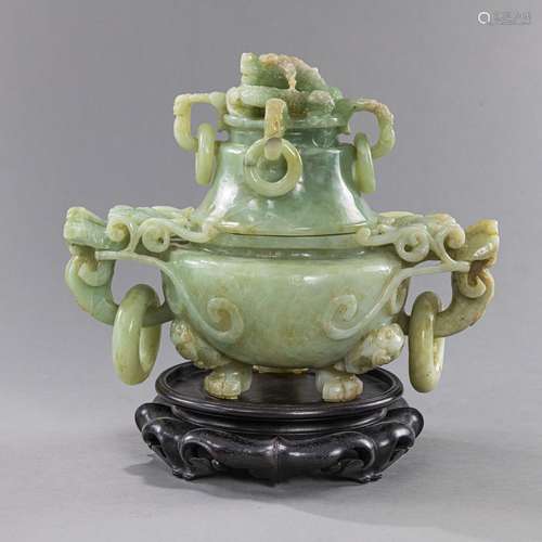 A JADE LIDDED VESSEL WITH DRAGON HANDLES AND LOOSE RINGS