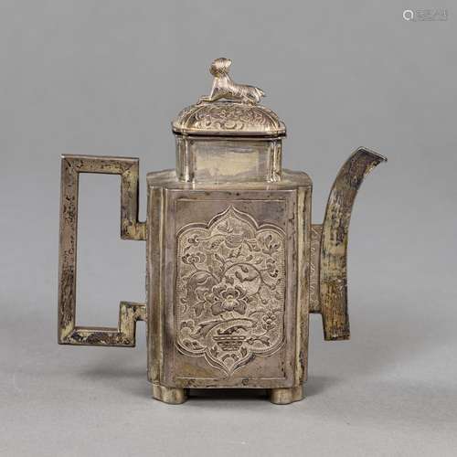 A SILVER FLORAL RELIEF TEAPOT