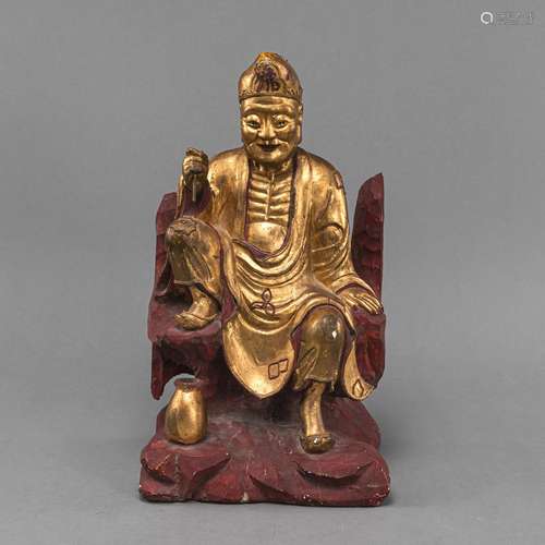 A PART-GILT WOOD FIGURE OF JI GONG