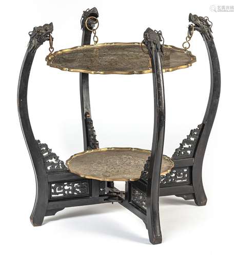 A DARK WOOD SMOKING TABLE DECORATED WITH DRAGON HEADS AND TW...