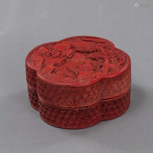 A SMALL CARVED CINNABAR LACQUER QUATREFOIL BOX AND COVER DEP...