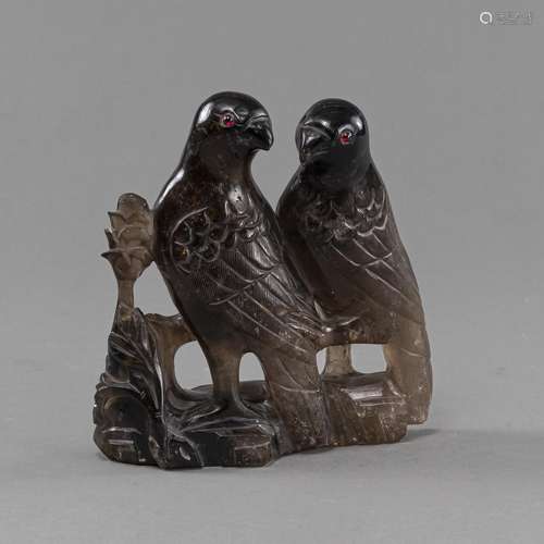 A PAIR OF BIRDS ON ROCK, CARVED FROM SMOKY QUARTZ